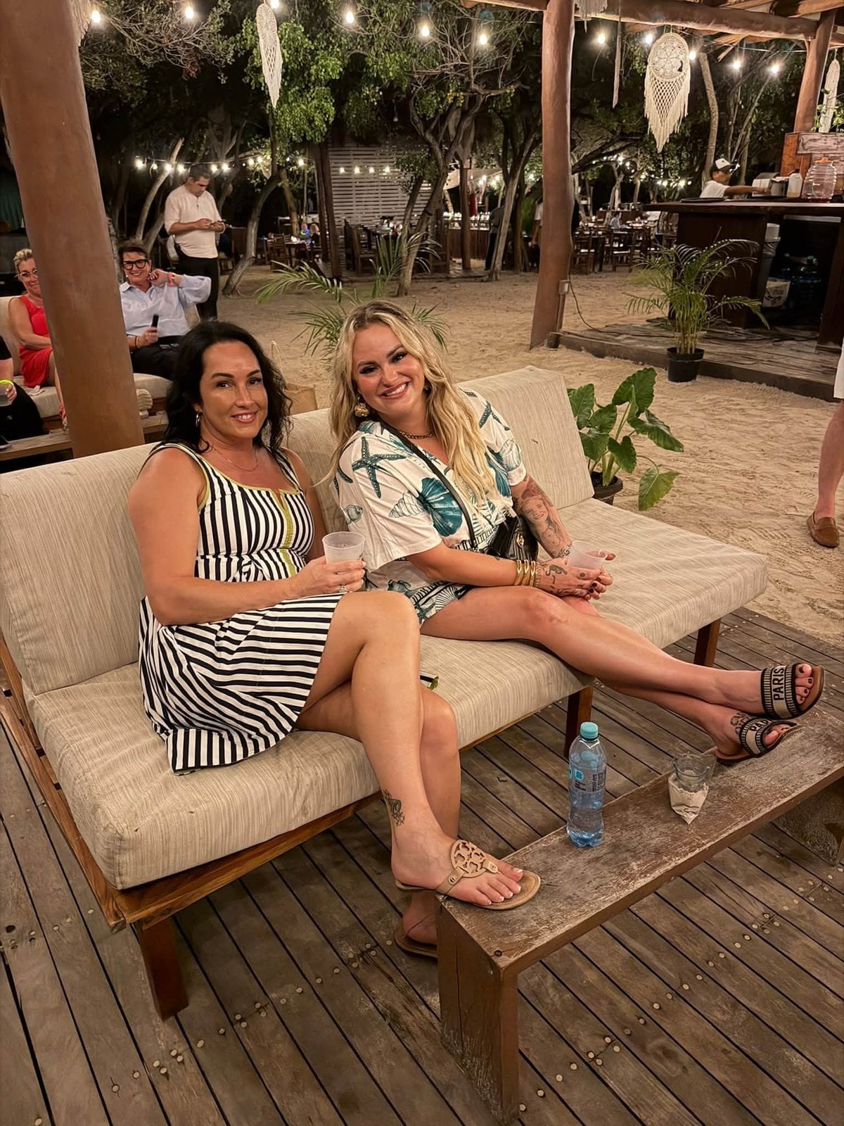 Travel advisors relaxing on plush cabana daybeds at private Isla Mujeres beach club