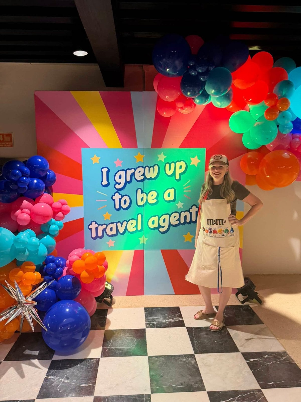Lia Vincent smiling at the When I Grow Up To Be A Travel Agent photo booth