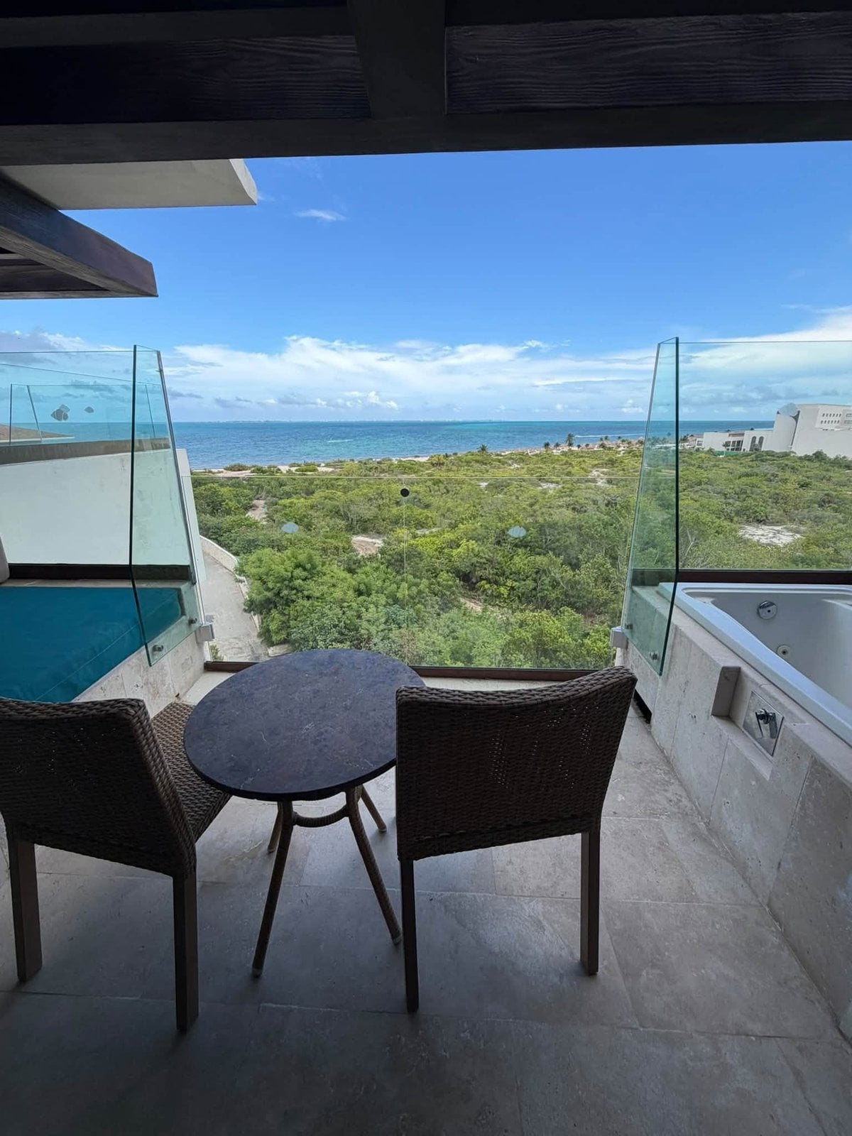 Unobstructed view of turquoise ocean from private terrace balcony at Dreams Playa Mujeres