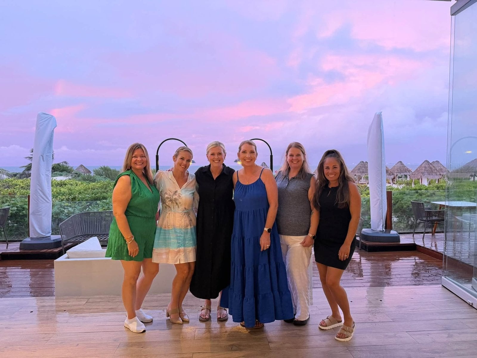 Golden hour cocktail reception on the rooftop terrace overlooking the Caribbean coastline