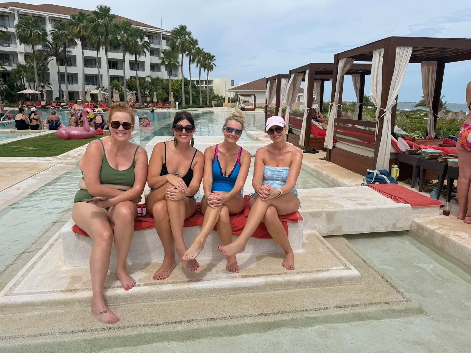 Relaxing right outside guest suites in the tranquil swim-out pool waters