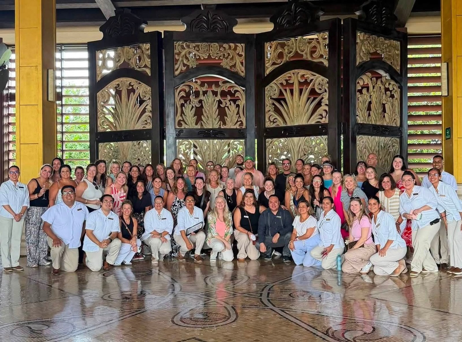 Vincent Vacations travel advisor team and supplier executives at Dreams Playa Mujeres Golf and Spa Resort grand lobby