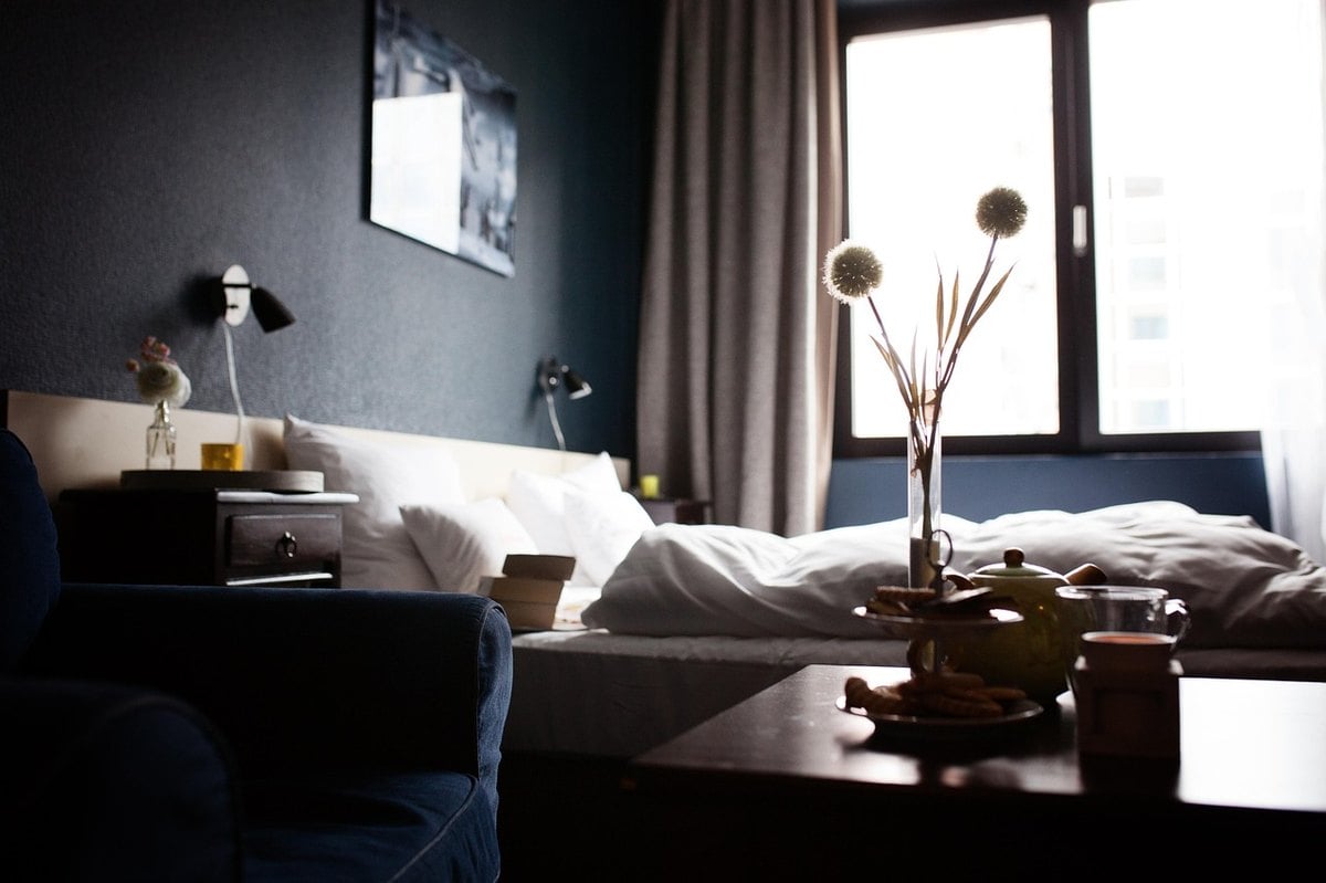 Five-star hotel suite VIP amenities setup with champagne, flowers, and executive welcome letter