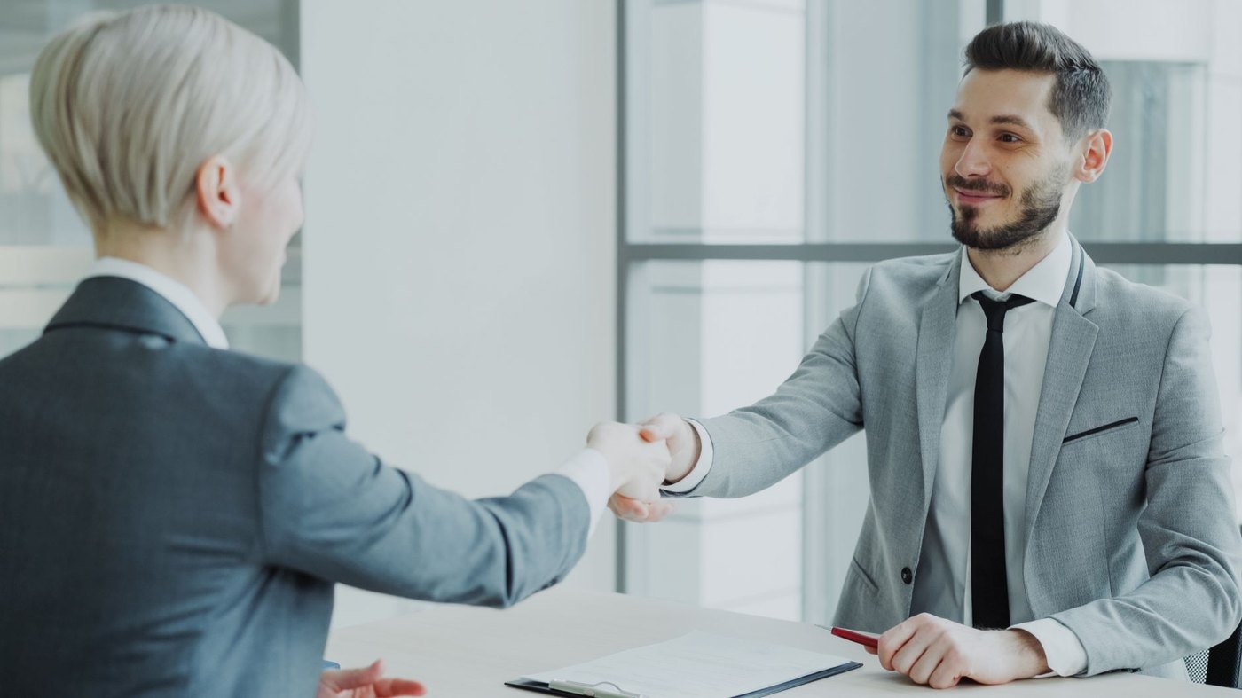 Travel agency owner interviewing candidate for associate independent contractor advisor position