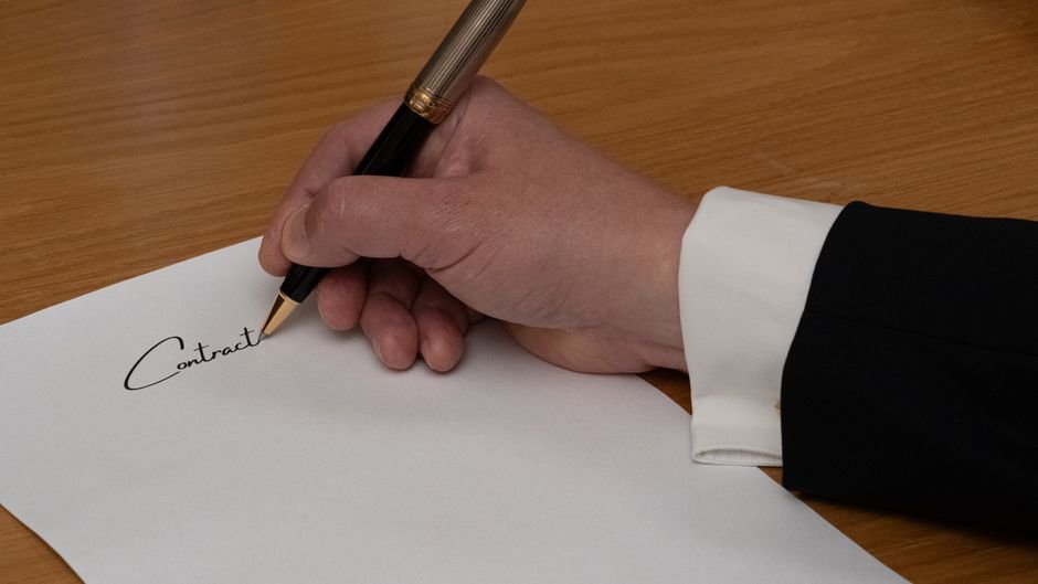 Legal travel insurance declination waiver agreement on desk with signature