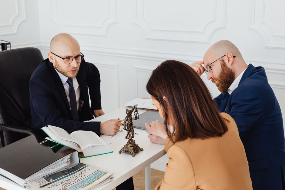 Travel advisor reviewing comprehensive travel insurance options with clients during consultation