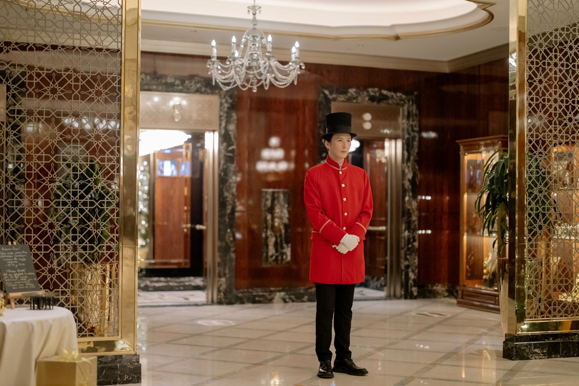 Luxury Five-Star Hotel Concierge Greeting Guests with Champagne