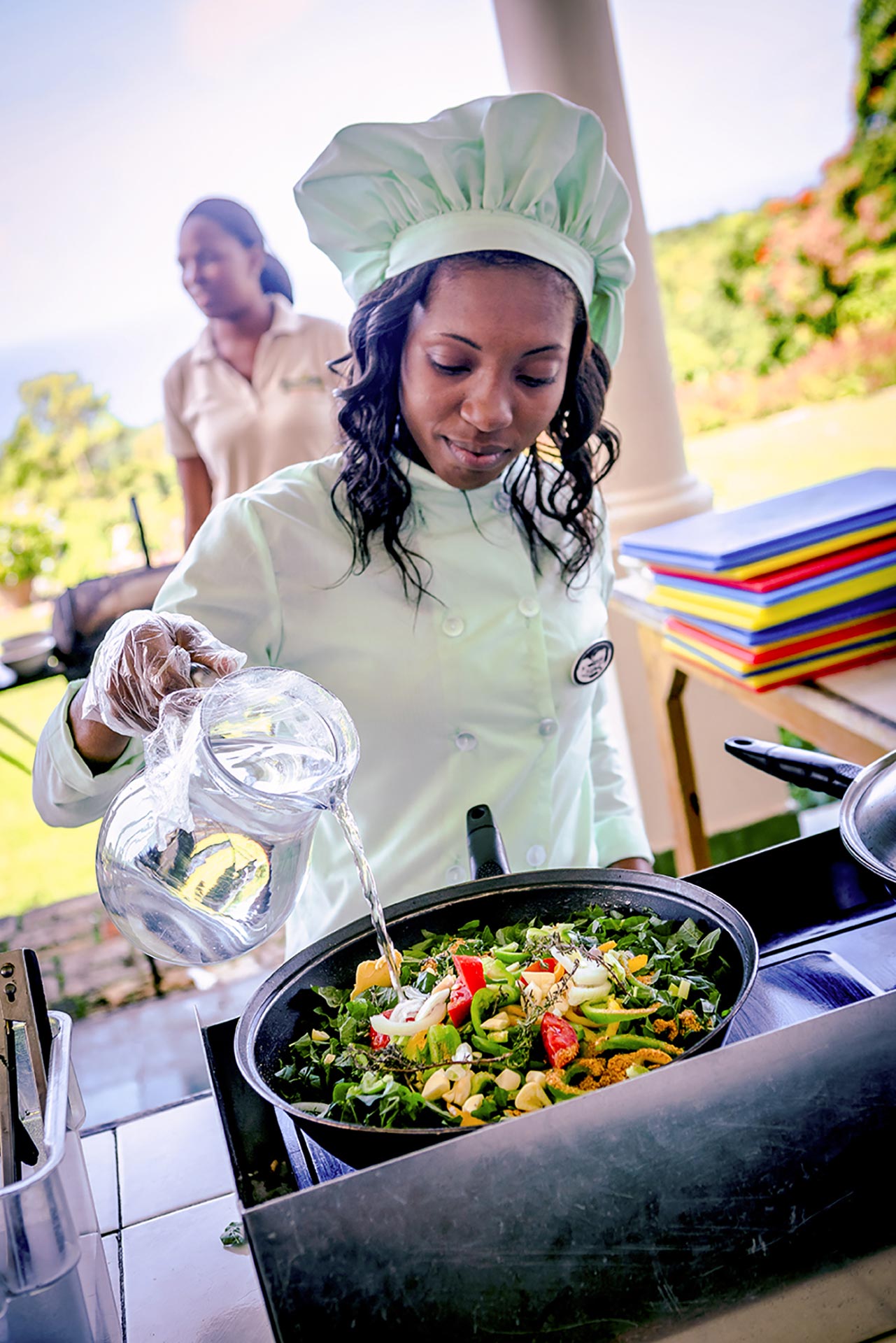 Jamaican chef preparing food