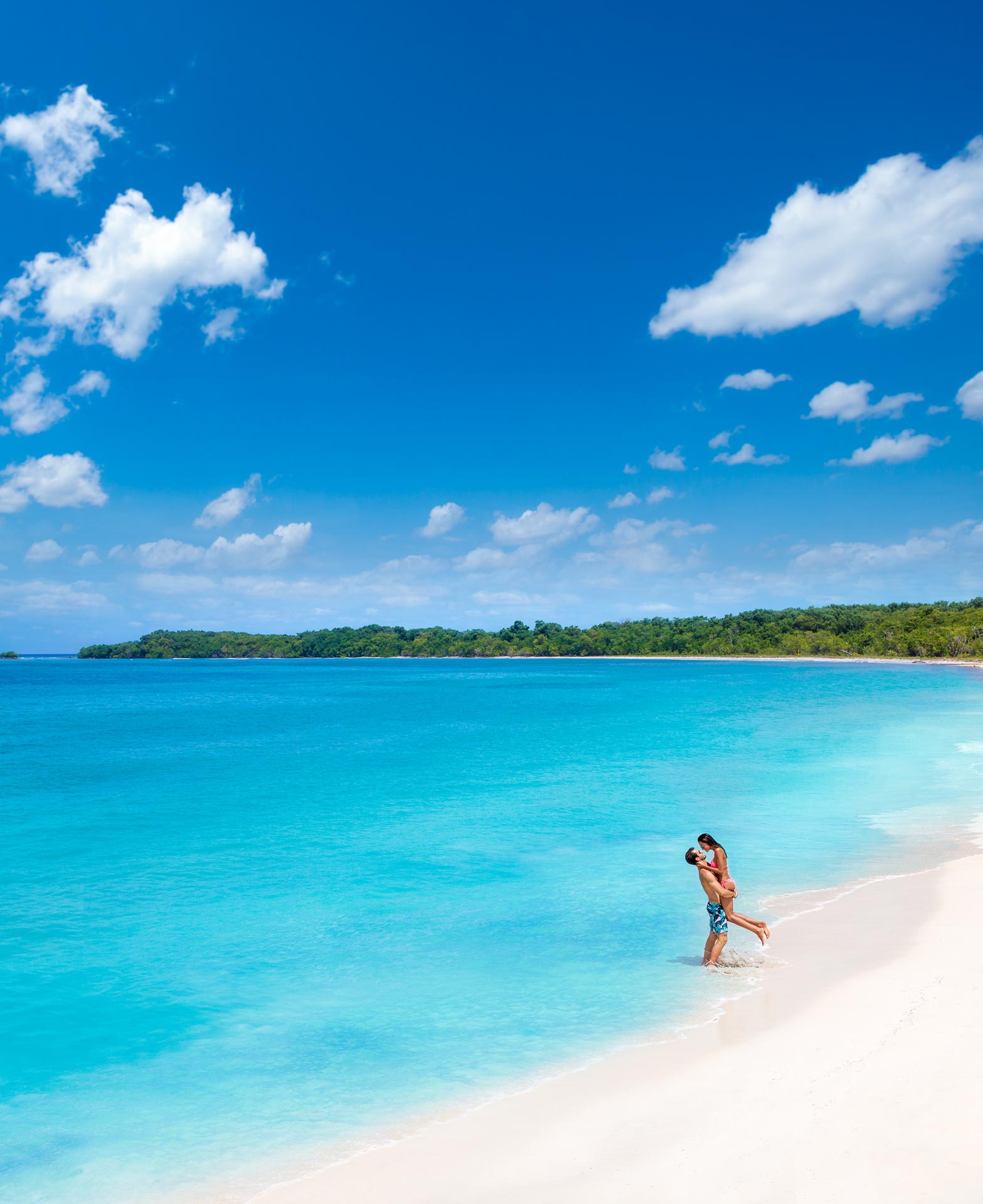 couple on honeymoon on a beach