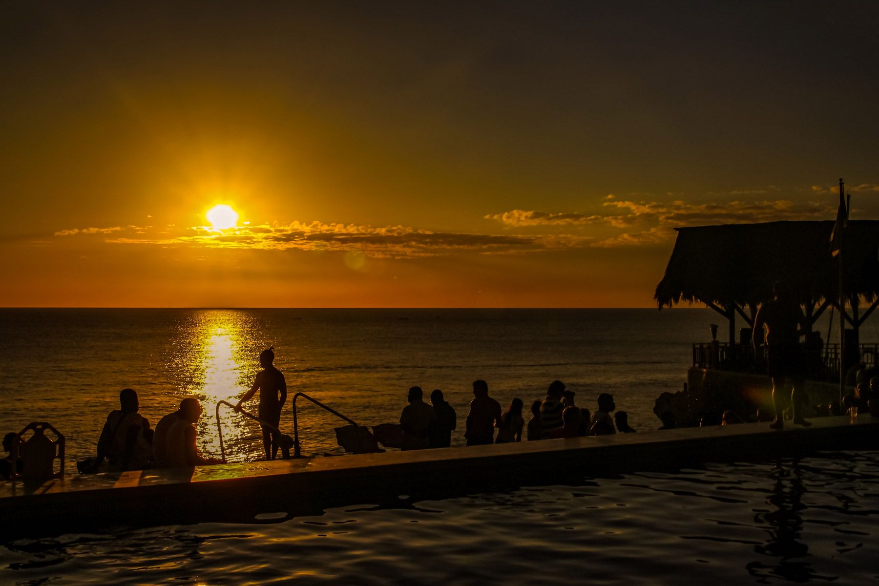 people enjoying sunset ricks cafe