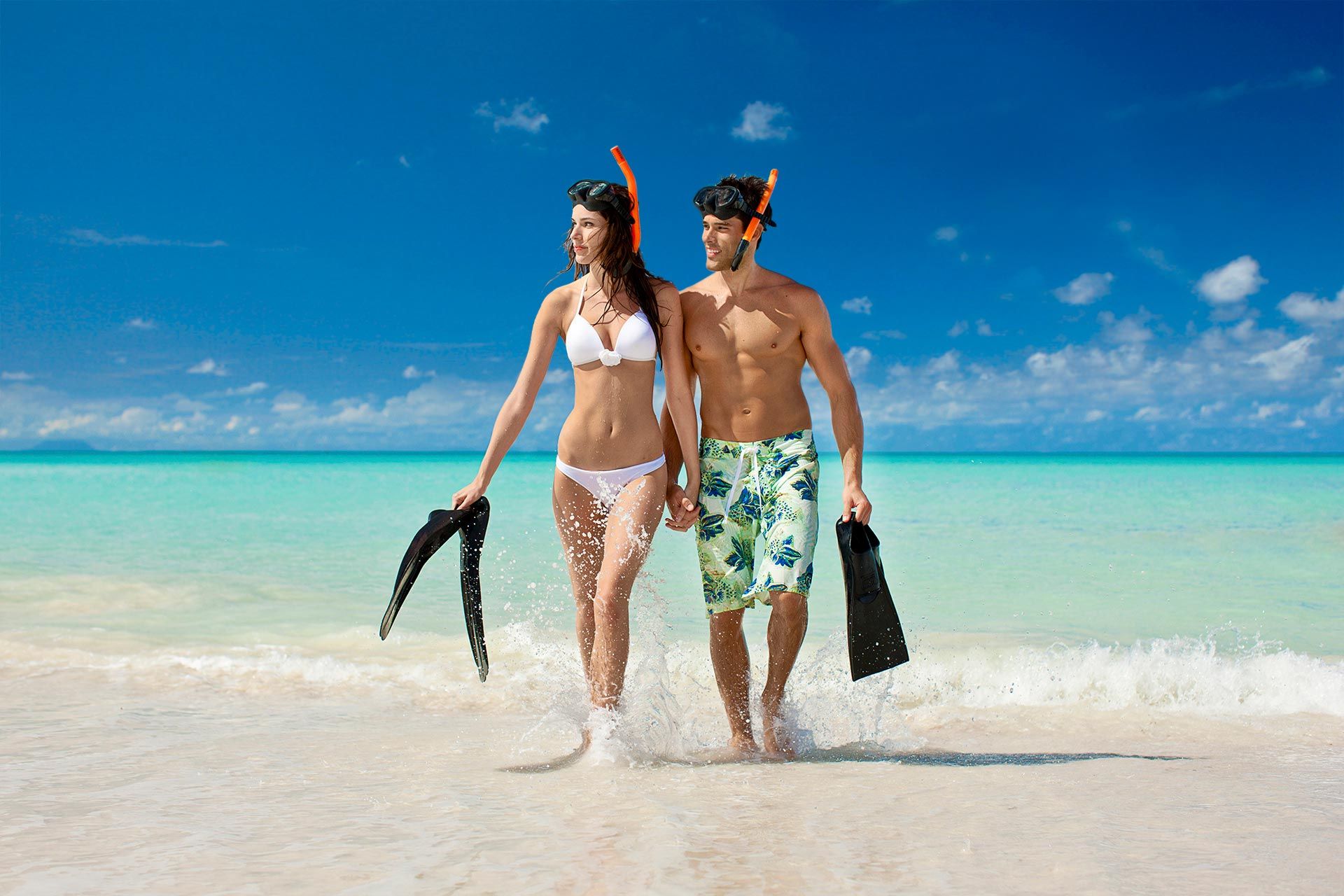 a couple wearing snorkeling gear