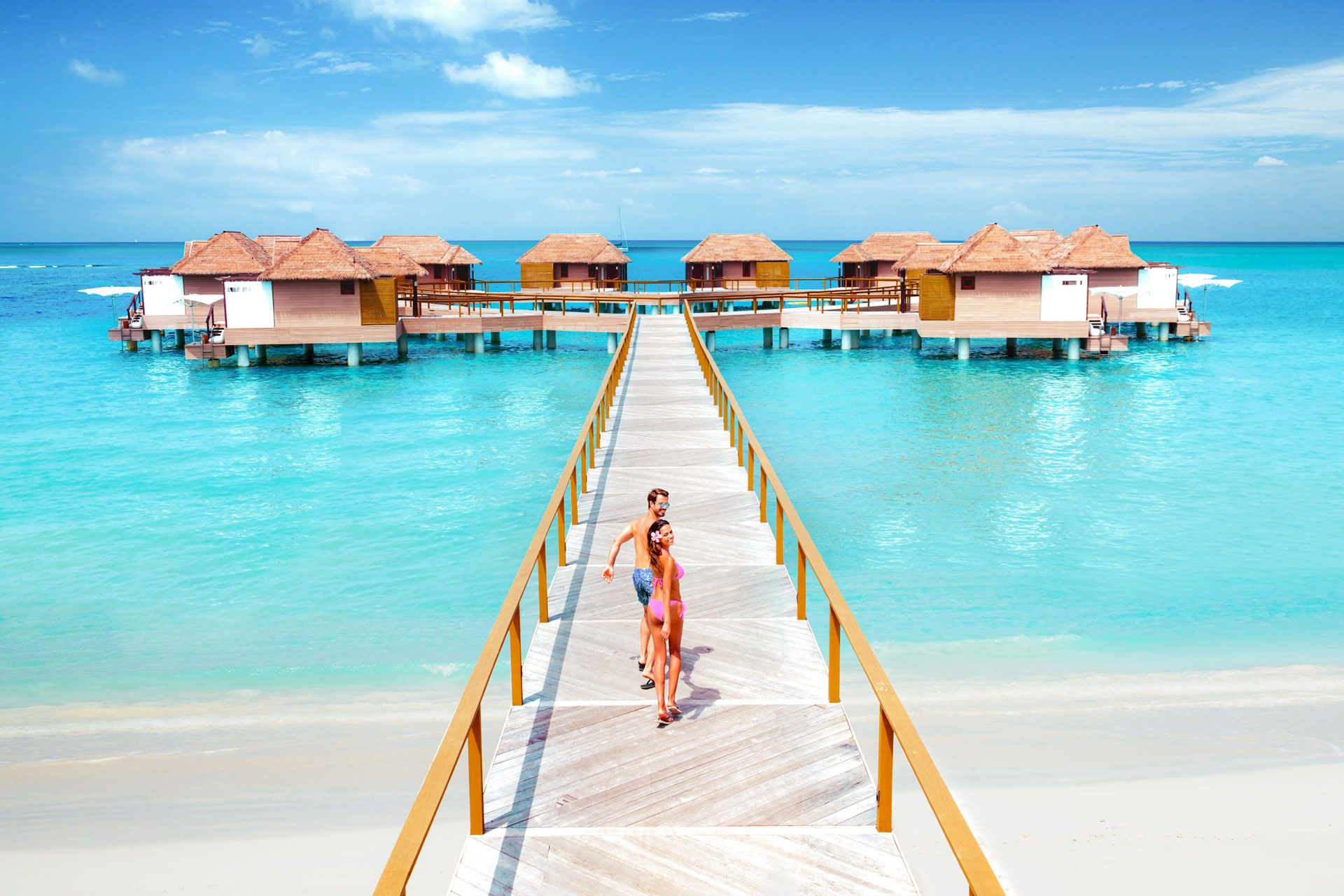 Couple at Sandals overwater bungalows