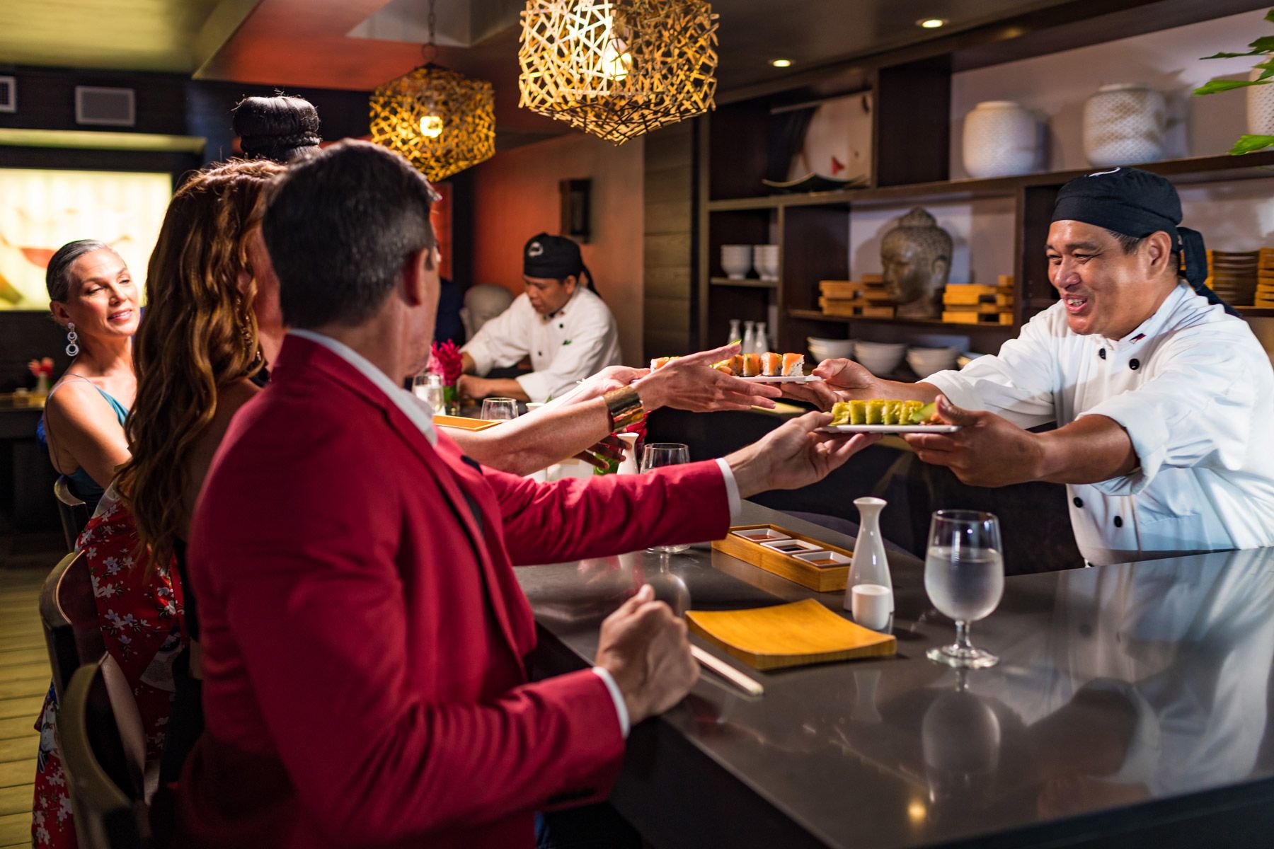 guests enjoying sushi at soy sushi bar at sandals grenada