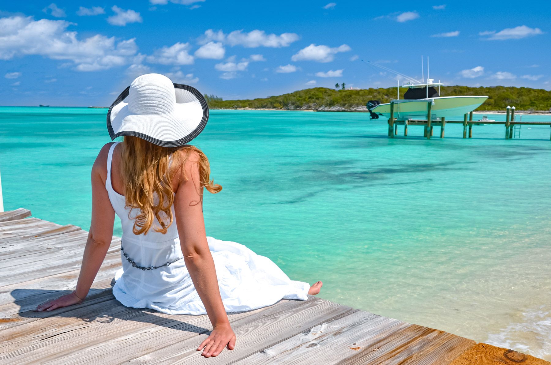 Girl wooden dock Exuma Bahamas