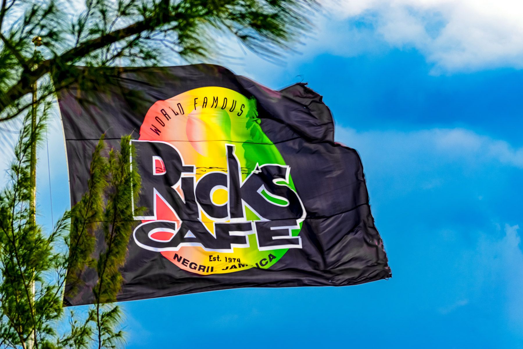ricks cafe cliffs flag closeup negril jamaica