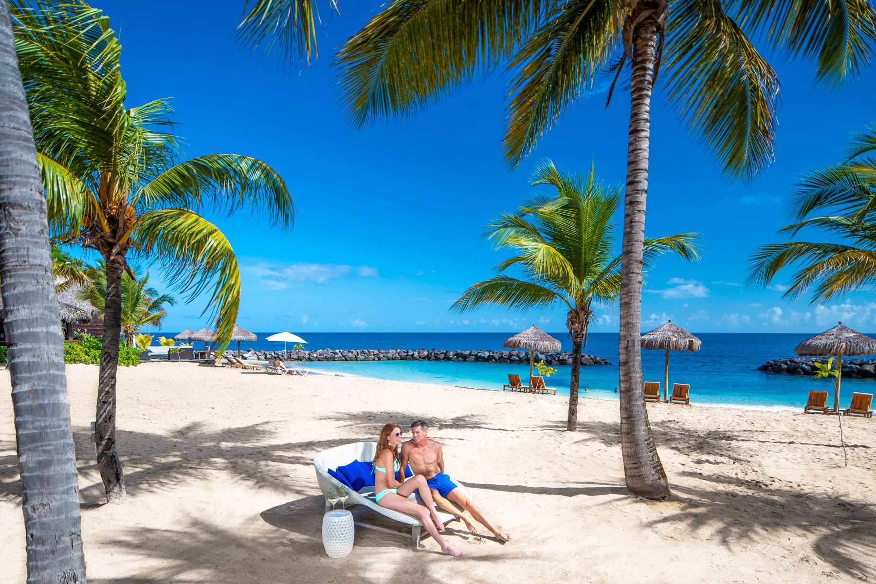 couple having fun at sandals grenada beach