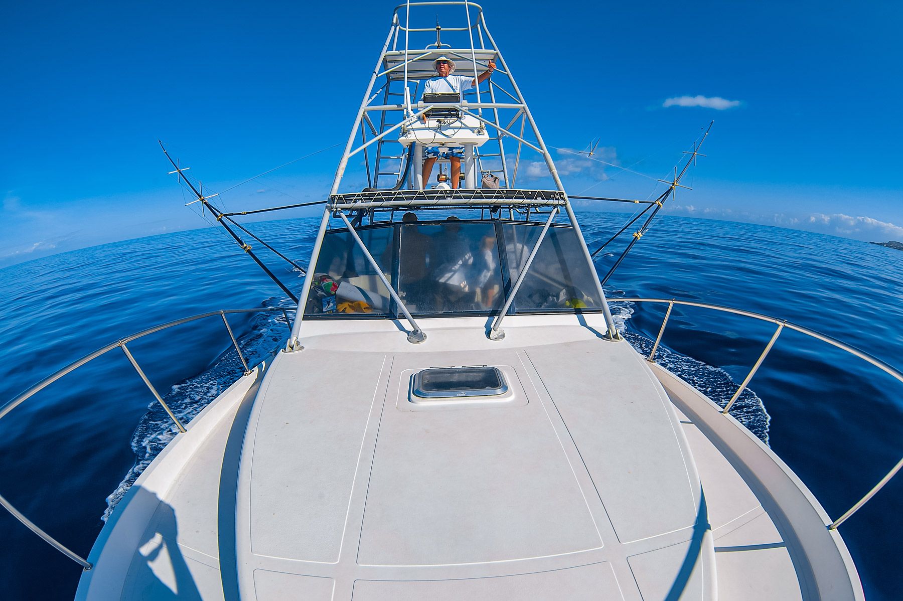 man drives fishing boat open sea