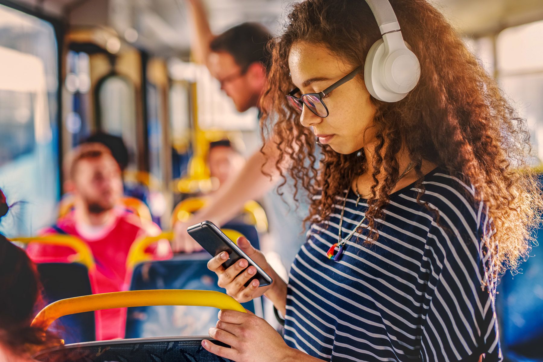 woman using smartphone subway