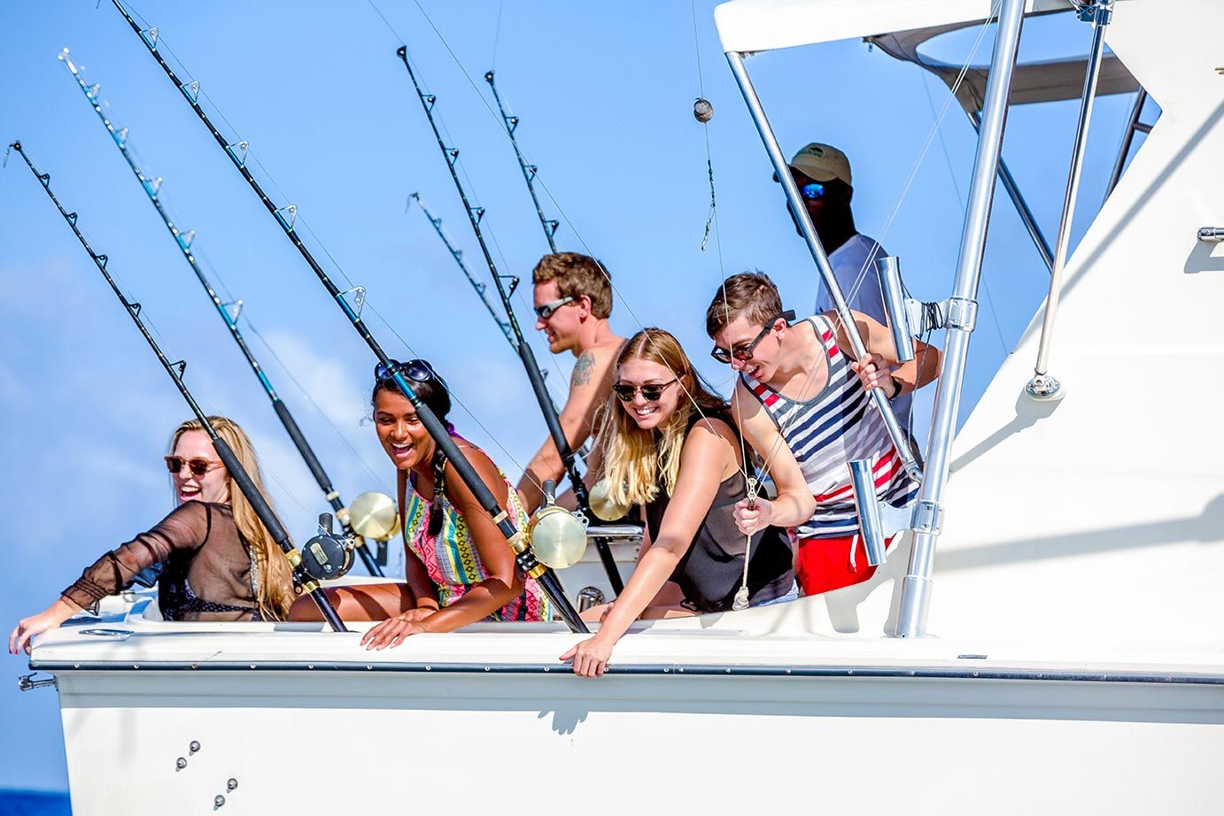 a group fishing on a boat