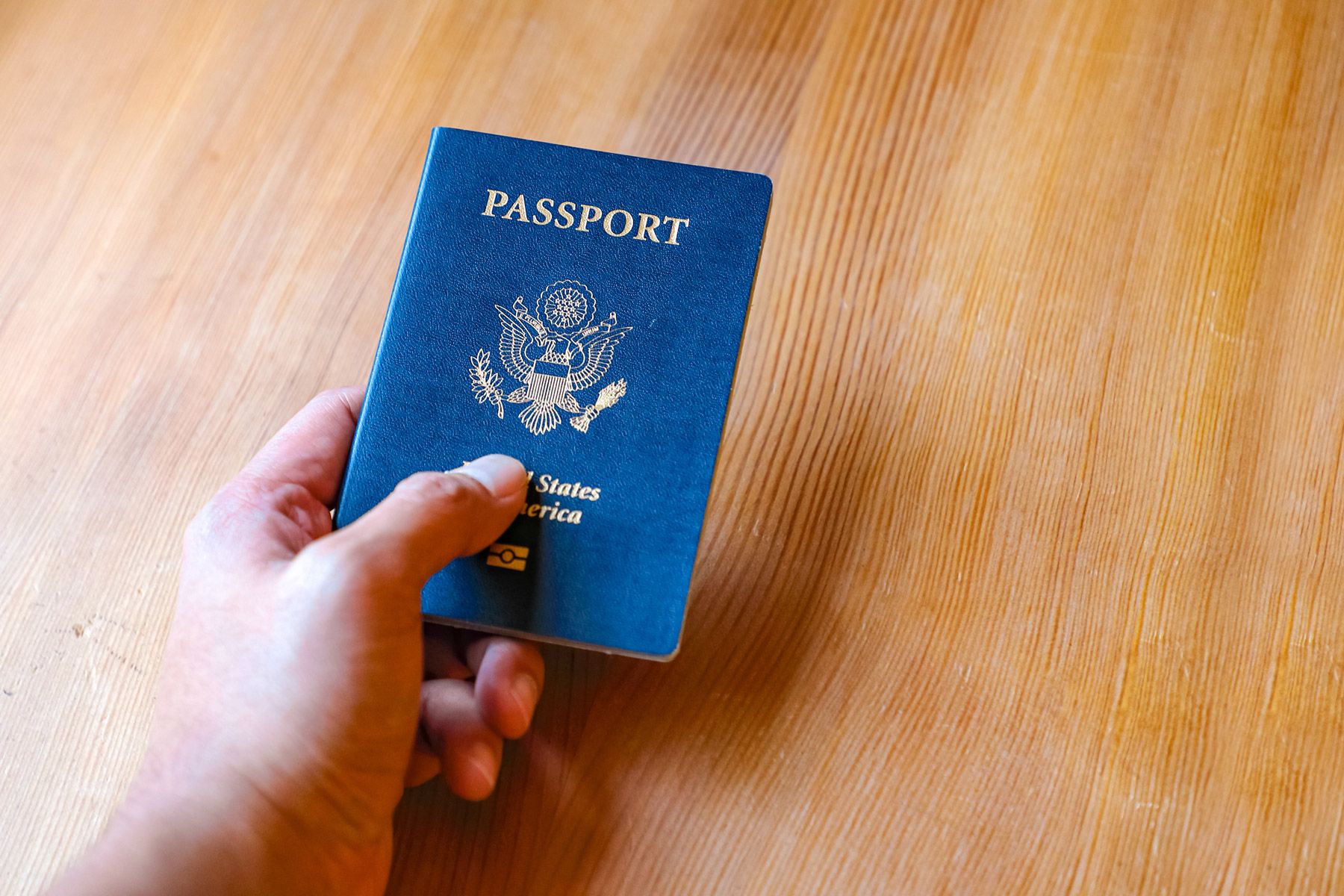 man holding U.S. passport