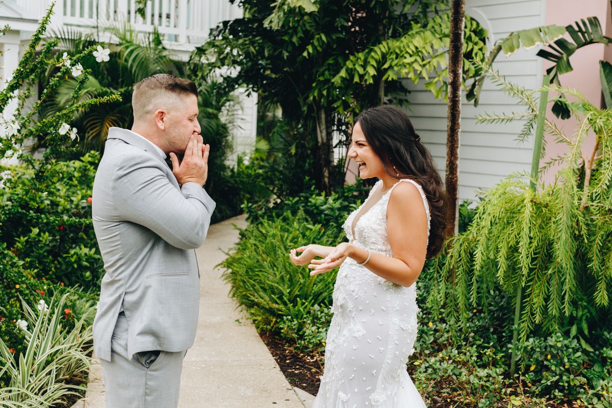 couple wearing wedding attire in a garden