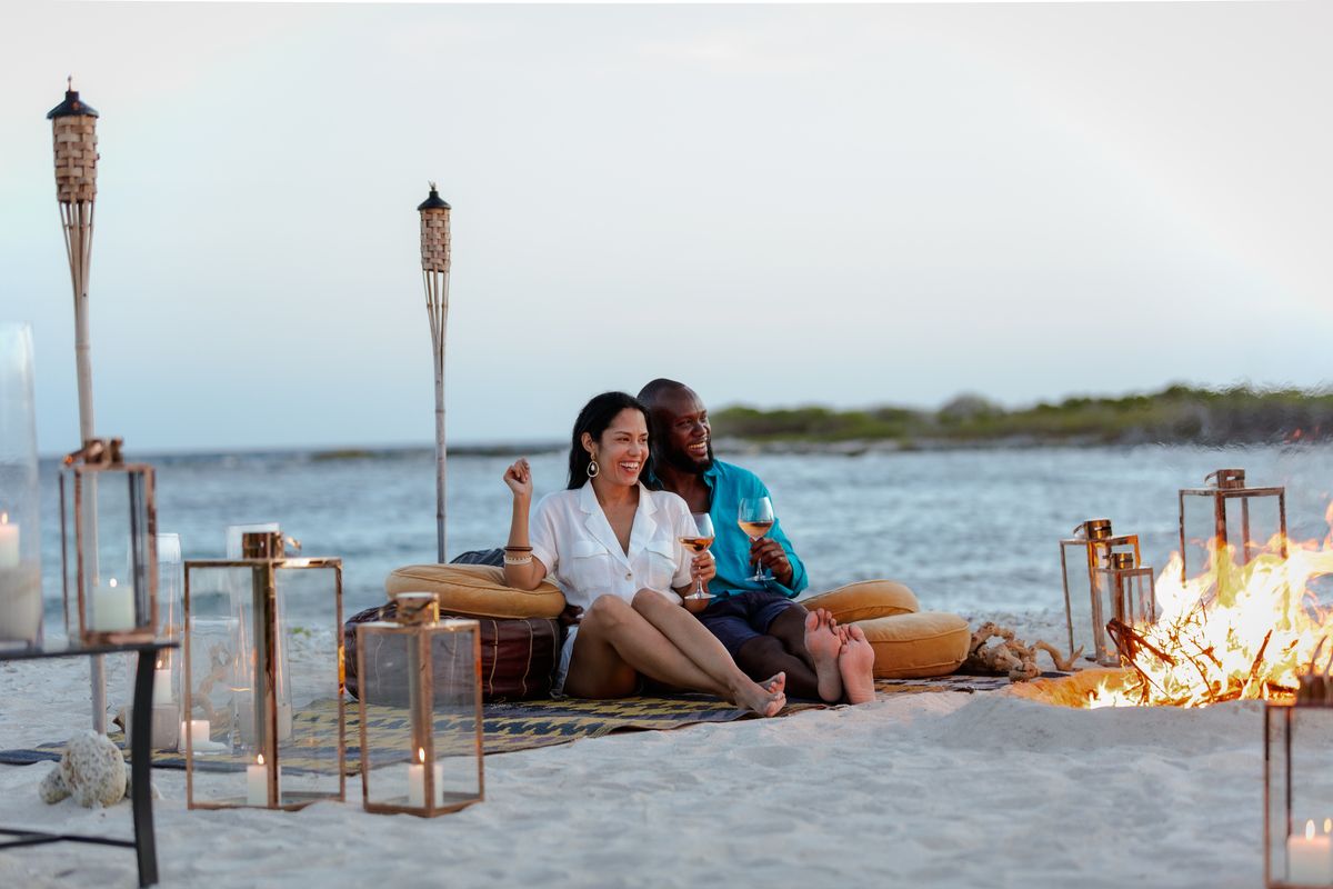 black couple romantic picnic on the beach