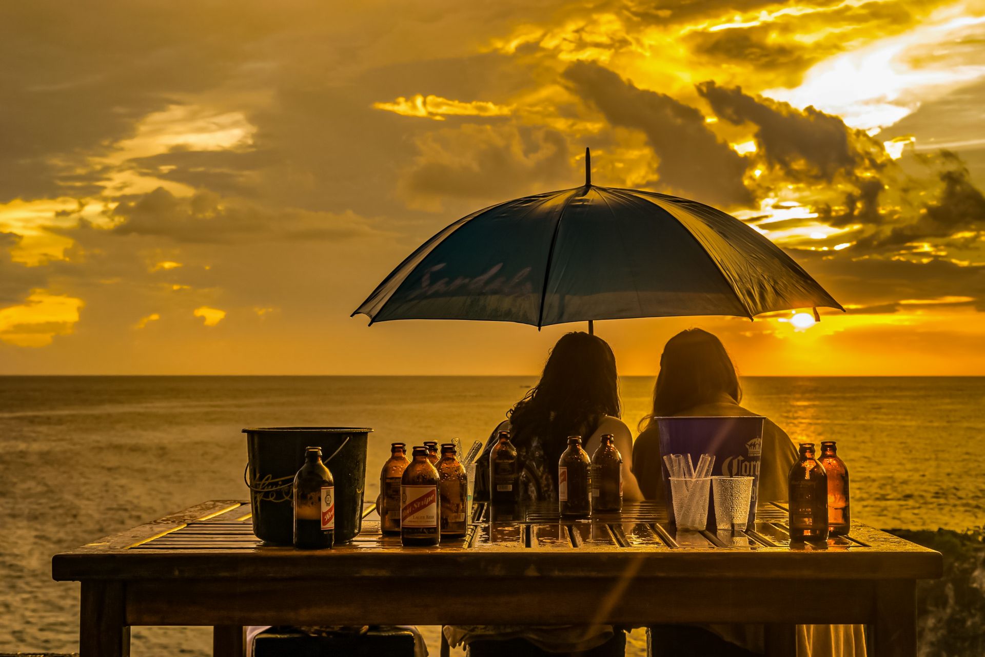 Couple watching sunset Ricks Cafe-Negril