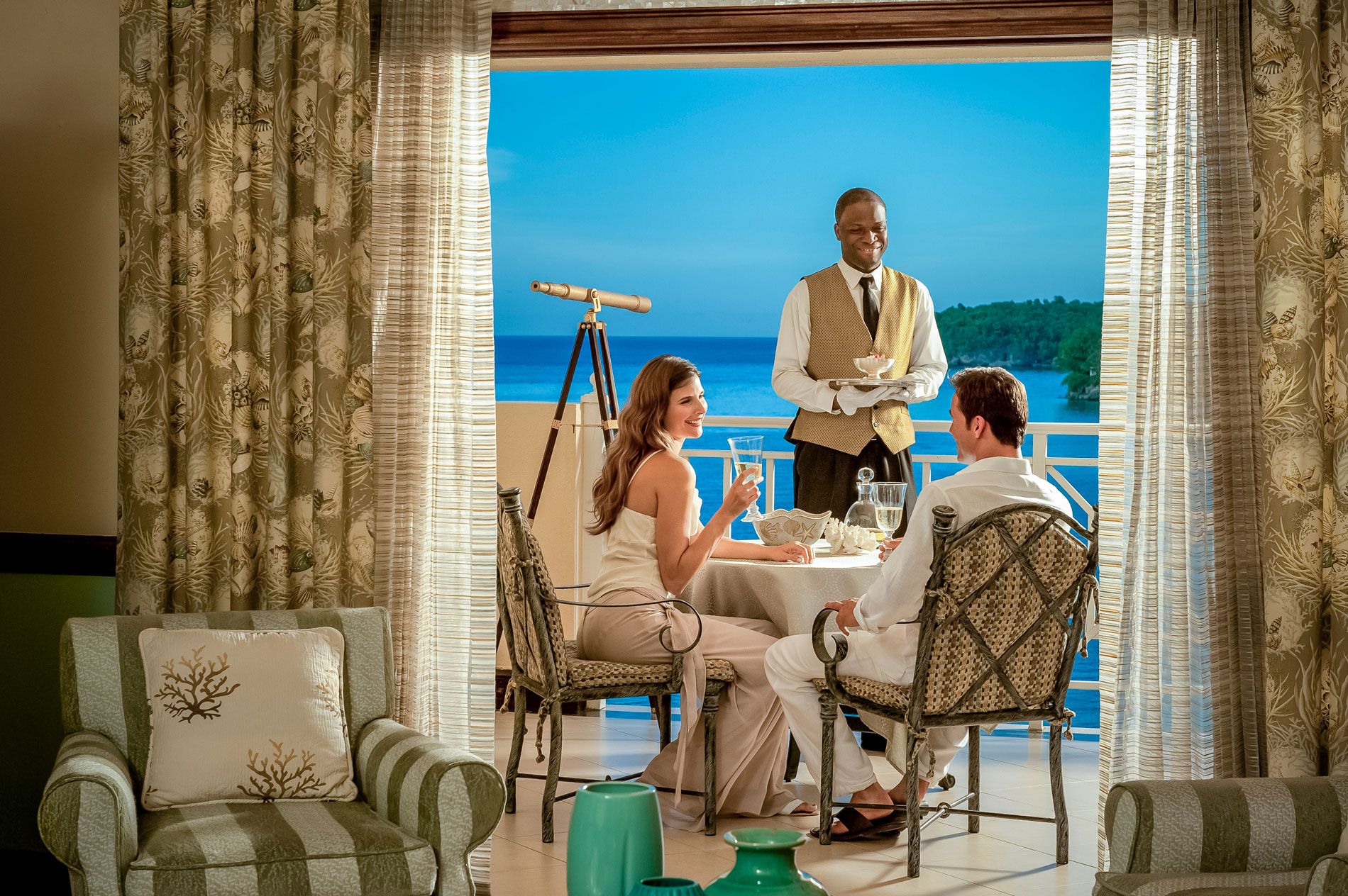 couple and butler on prime minister suite's balcony