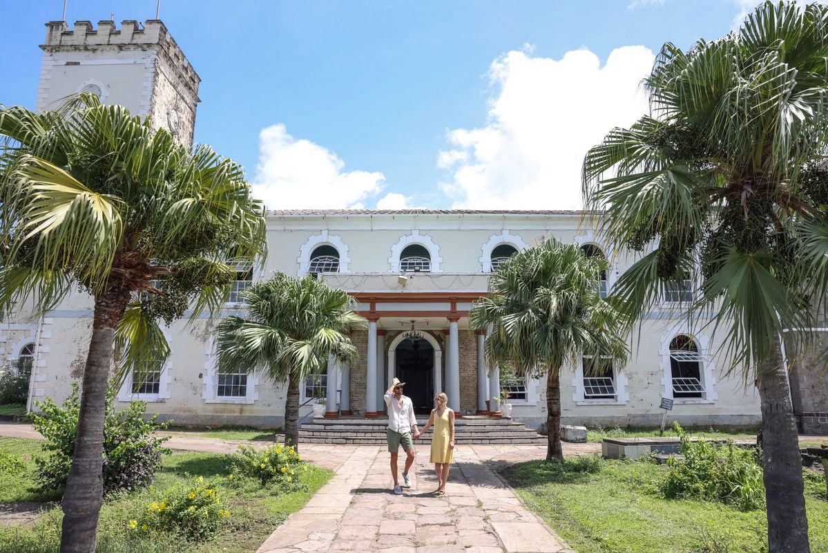 couple in front of a historical building in st vincent