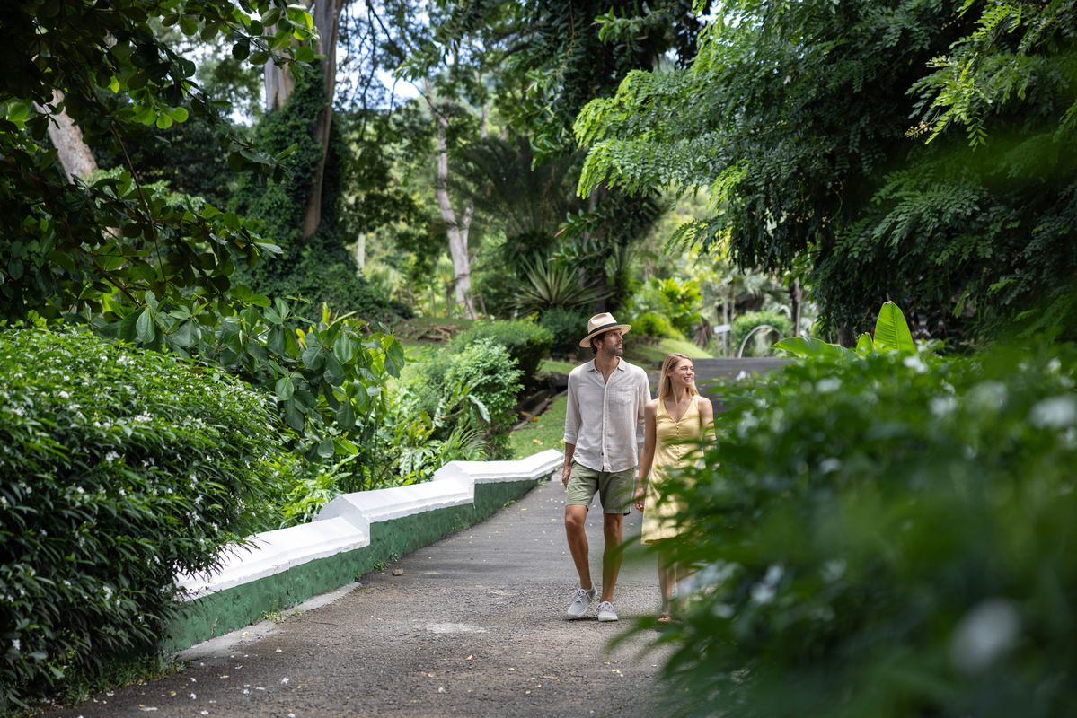 couple walking through gardens in st vincent