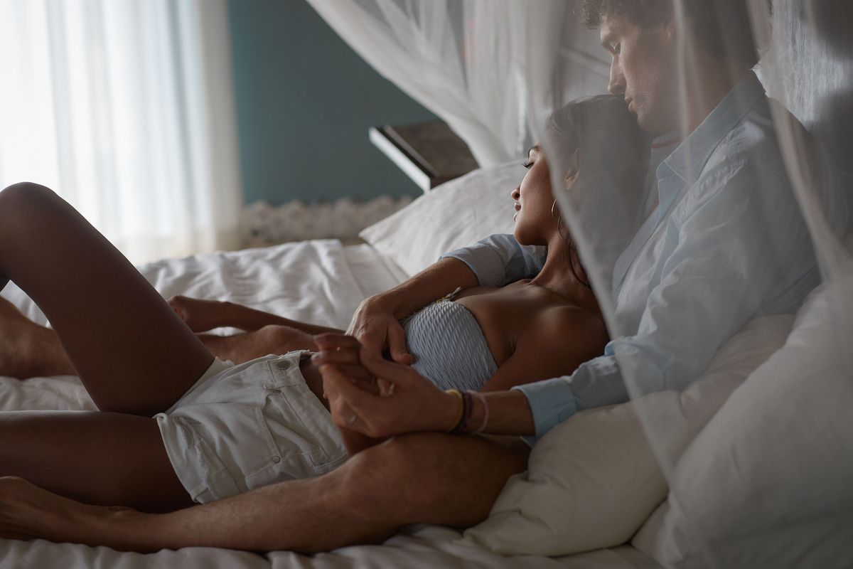 couple relaxing in bed