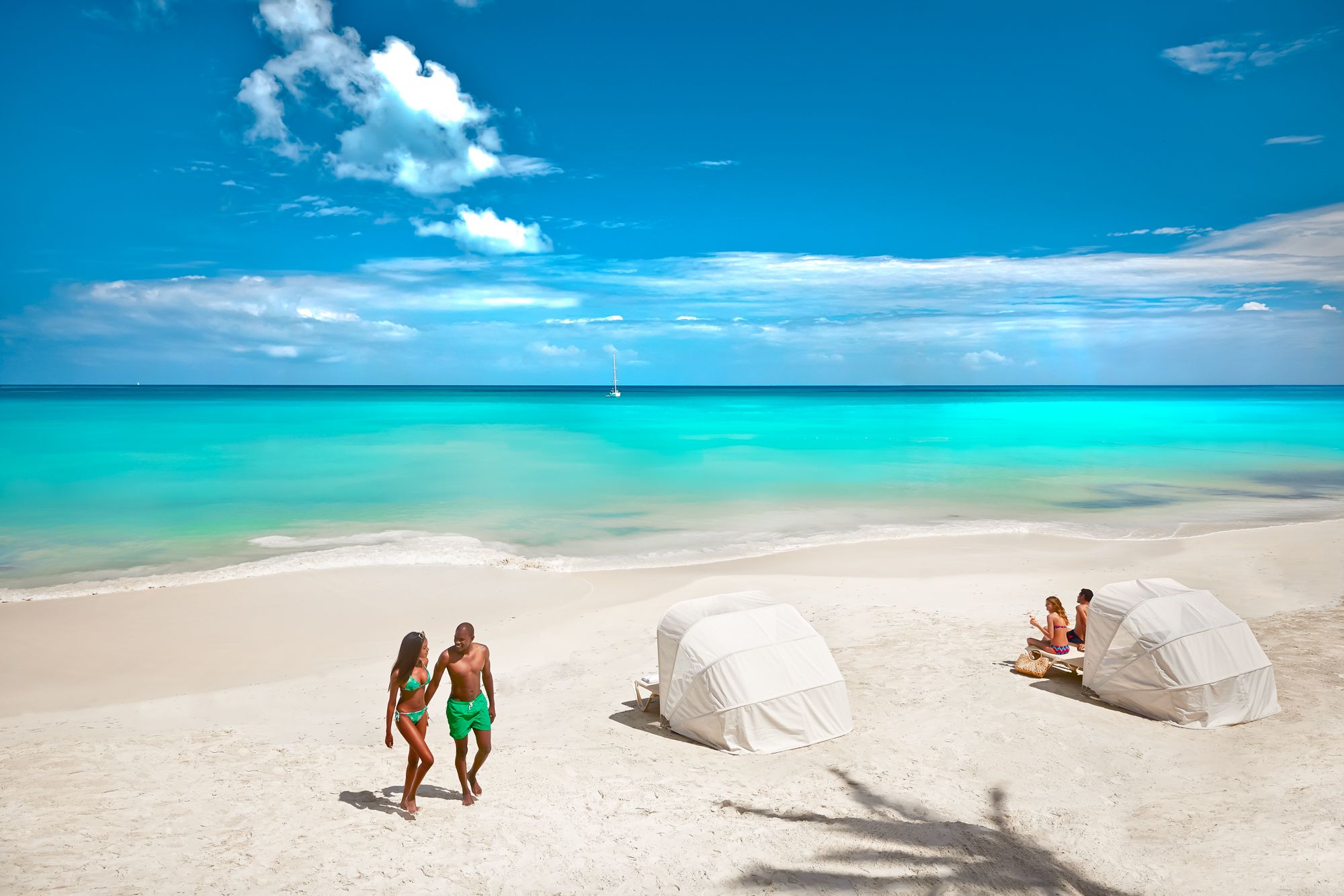 Beach huts adorned in the sand make for the perfect seaside napping spot.