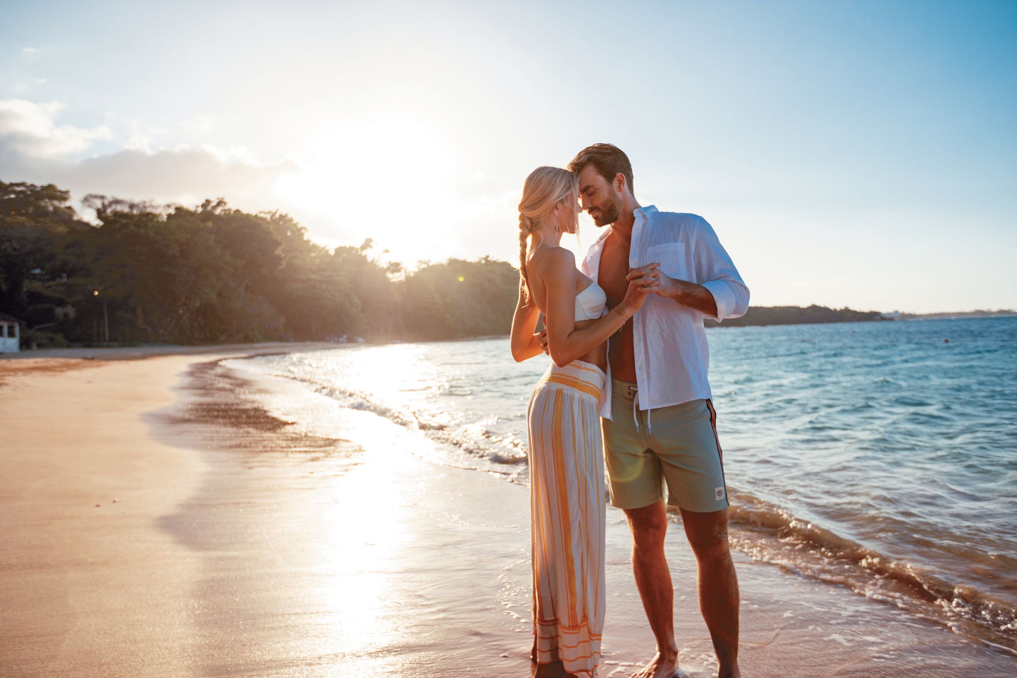 couple on the beach at sunset