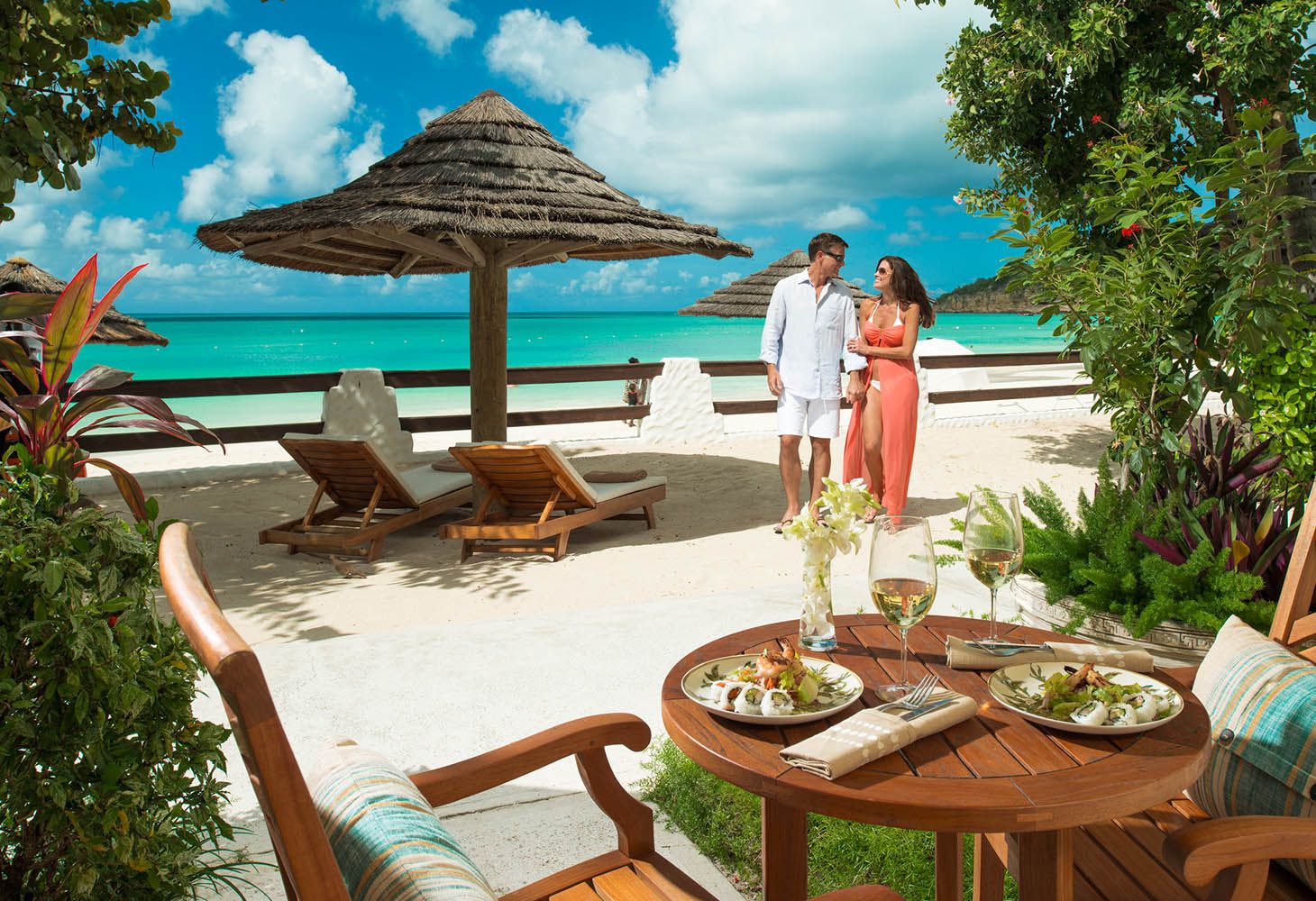 couple on the beach at Sandals Grande Antigua