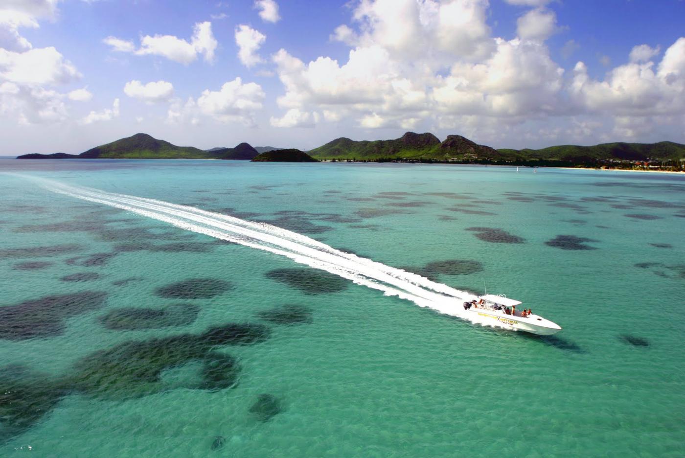 racing boat speeding through antiguas coastline