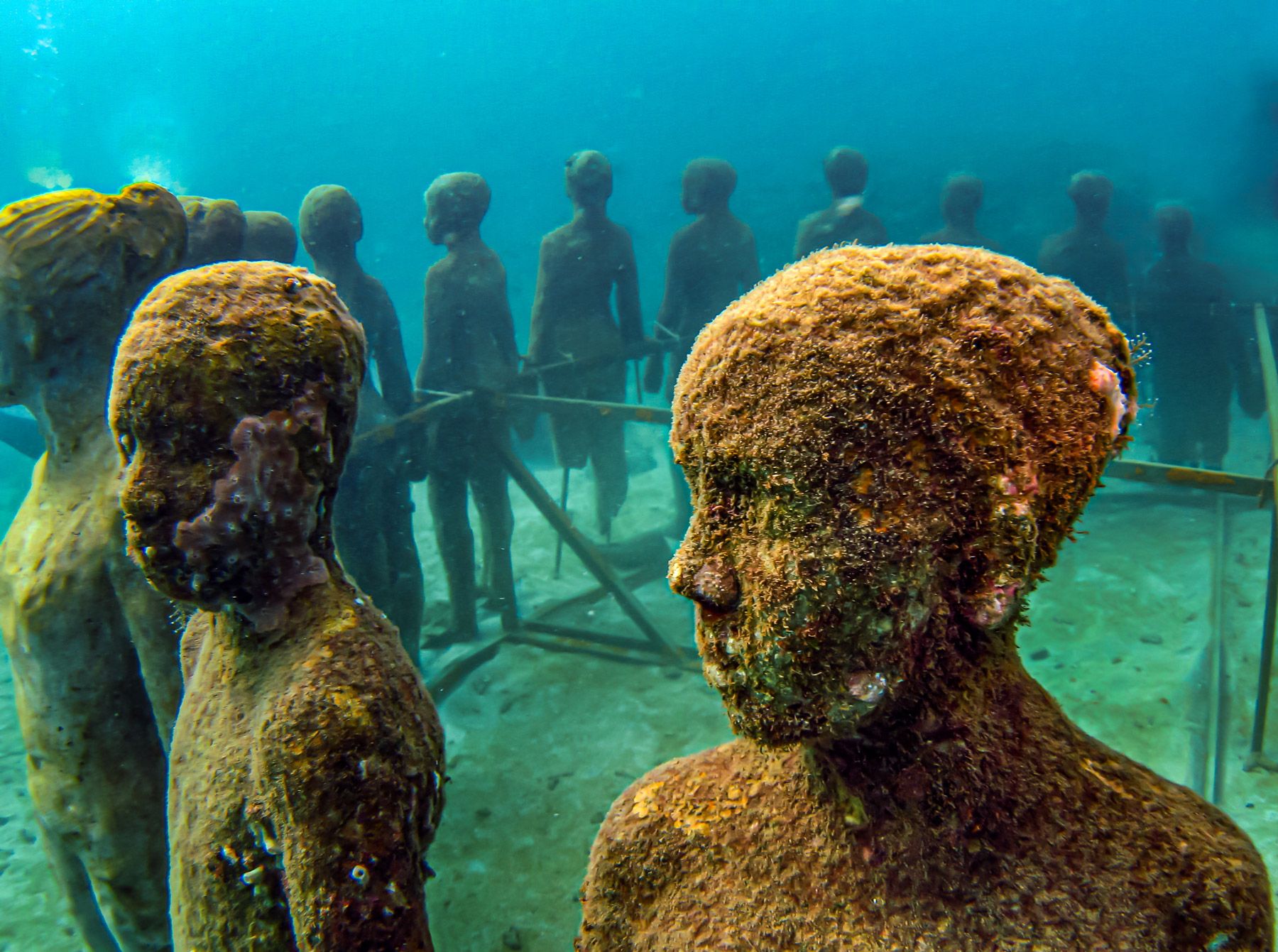 Grenada Underwater Sculpture Park children face close up
