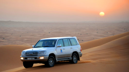 4x4 Desert Safari with Dune Bashing, Sandboarding & Camel Ride